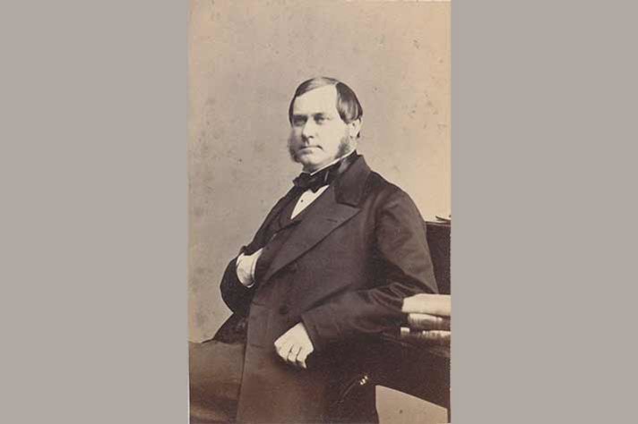 Louis De Geer the Elder sits at a desk.
